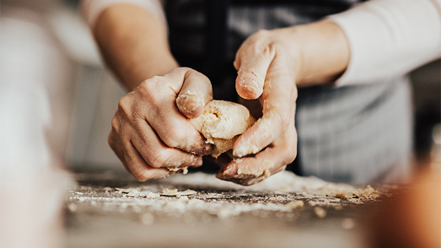 Baker kneading artisanal dough